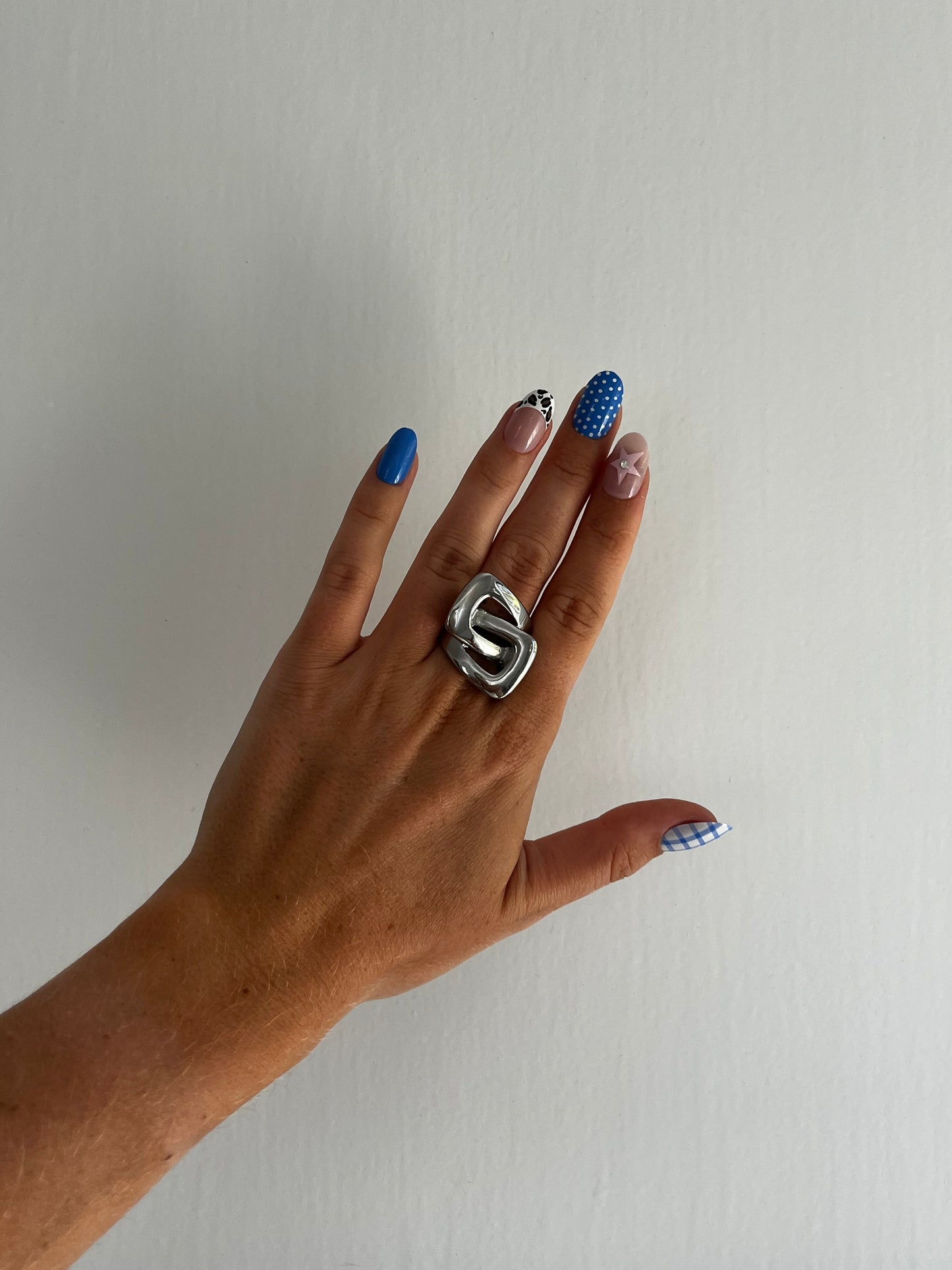 Angled view of THE KARL stainless steel ring with geometric cut-out design, bold unisex statement piece