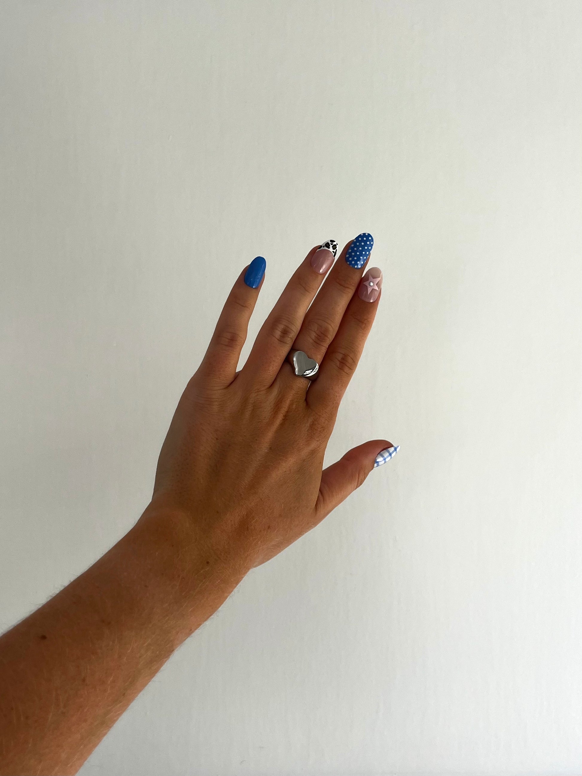 LOVIE ring, bold silver heart-shaped statement ring for men and women, timeless and playful design.