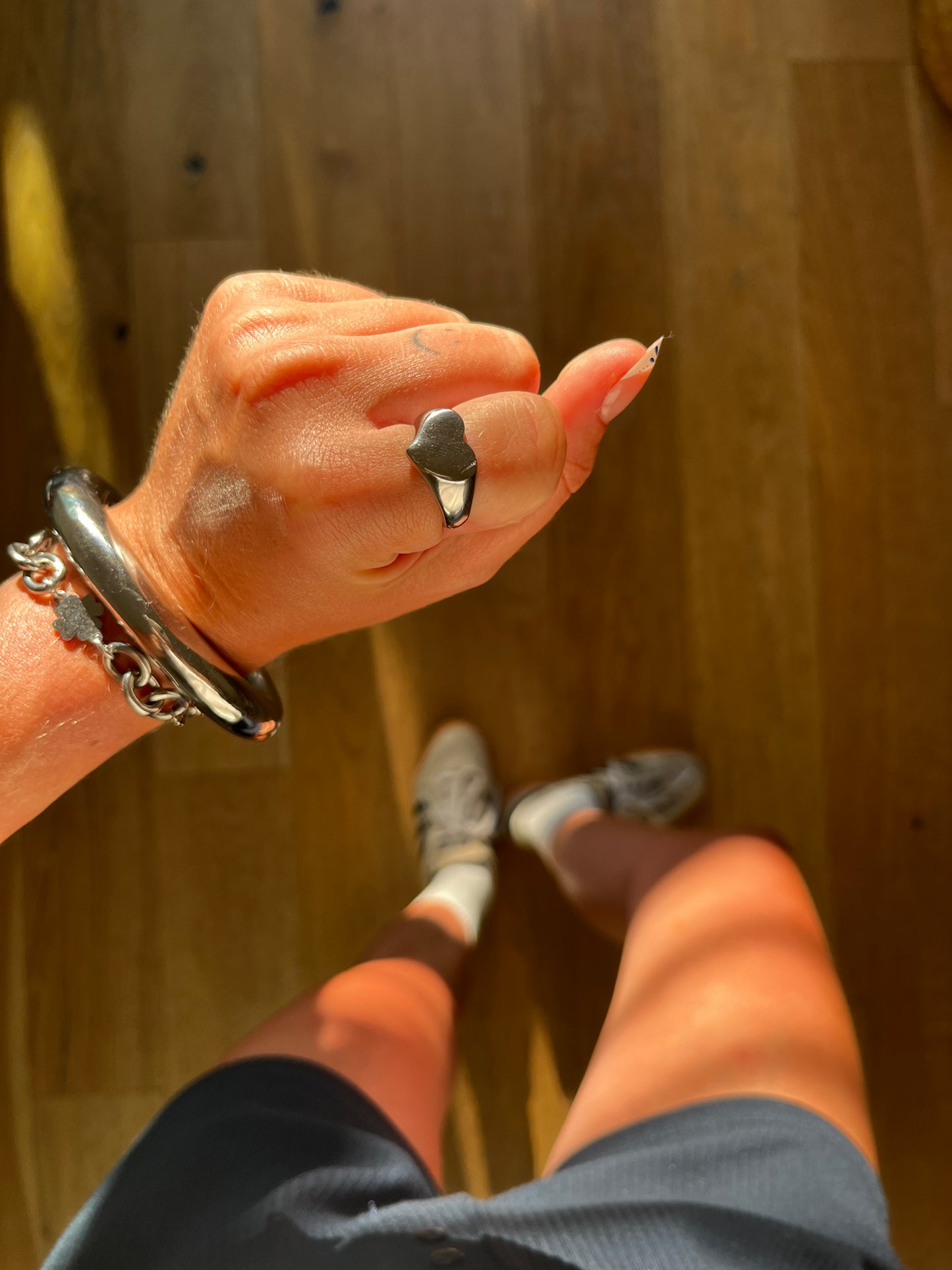 Side view of LOVIE heart-shaped silver ring, chunky statement jewelry for stacking or solo wear.