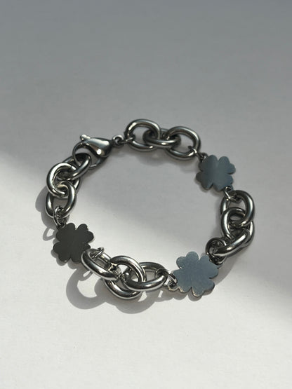 Product image of closeup unisex chunky clover charms chain bracelet in silver stainless steel, water and sweat proof