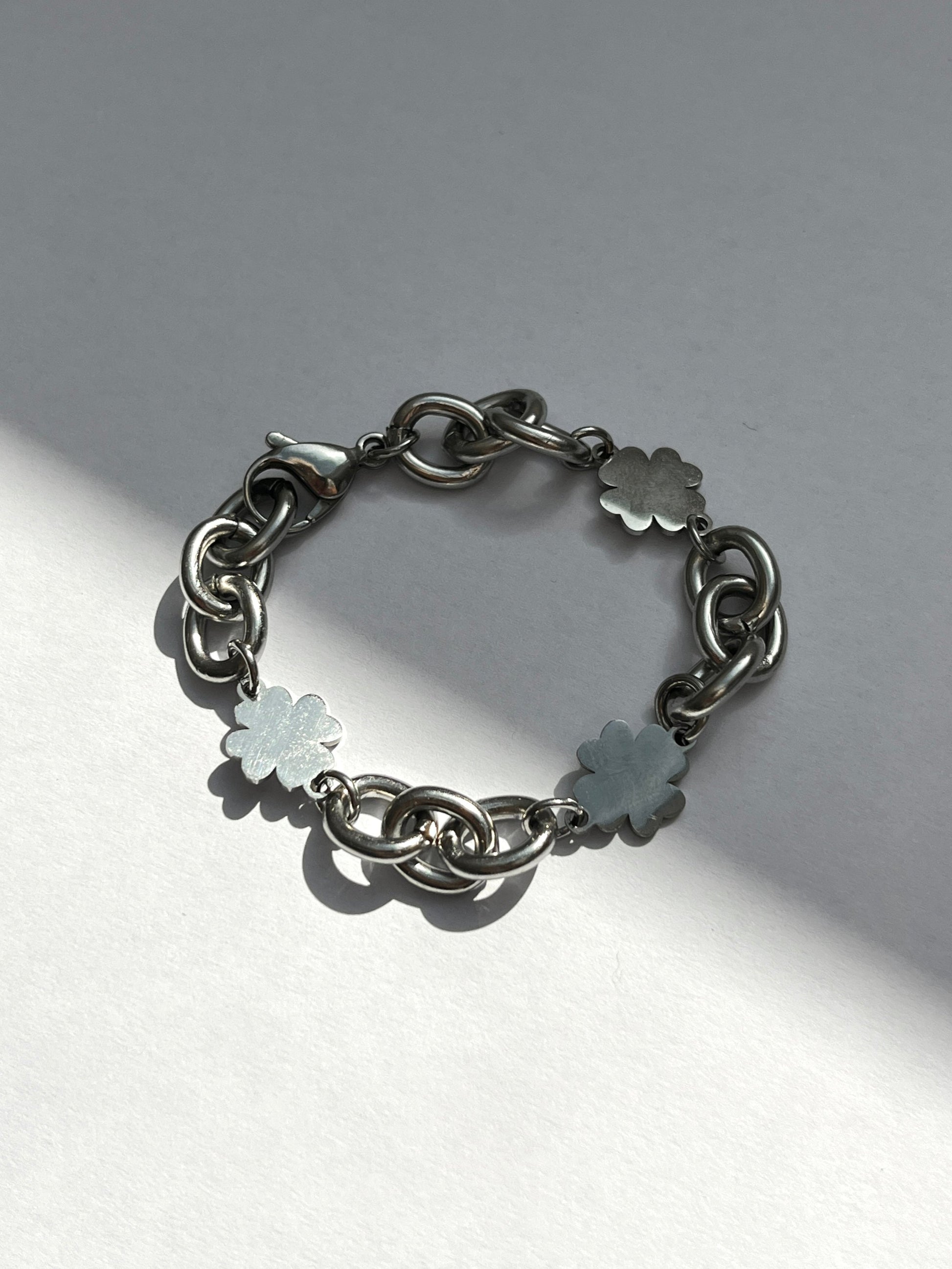 Product image of unisex chunky clover charms chain bracelet in silver stainless steel, water and sweat proof