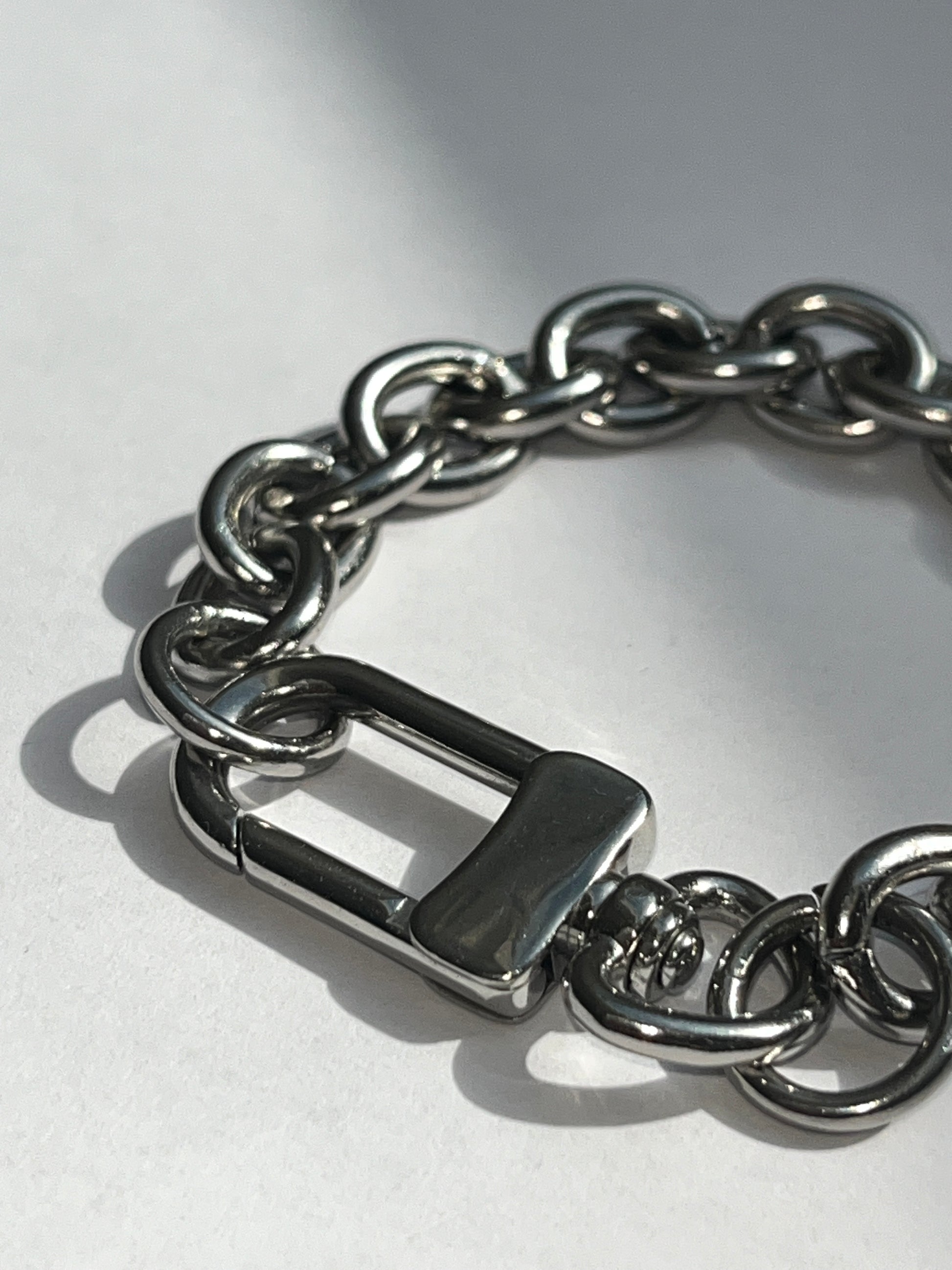 closeup of unisex silver stainless steel silver grand clasp bracelet 