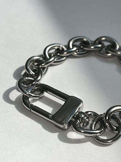 closeup of unisex silver stainless steel silver grand clasp bracelet 