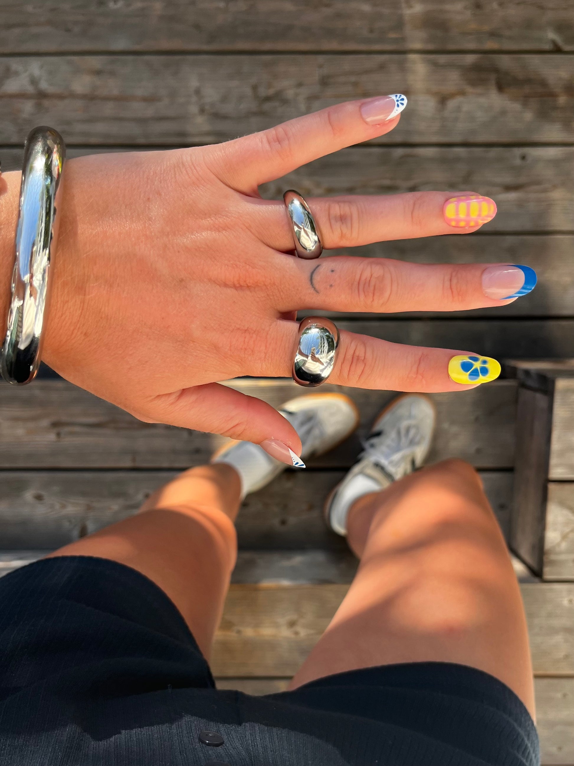 unisex statement silver stainless steel small dome ring styled with big dome ring and clean bangle
