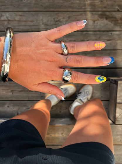 unisex statement silver stainless steel small dome ring styled with big dome ring and clean bangle