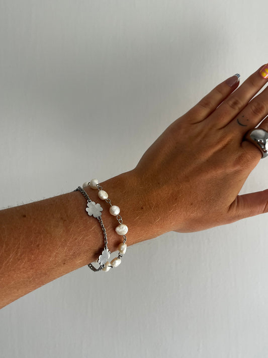 Closeup of THE ANEMONE BRACELET showing freshwater pearls and stainless steel pins, sleek unisex statement piece