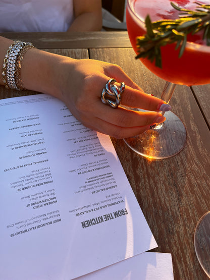 Side view of THE CHUNKER stainless steel ring showing chunky interlocked loop design, unisex statement piece