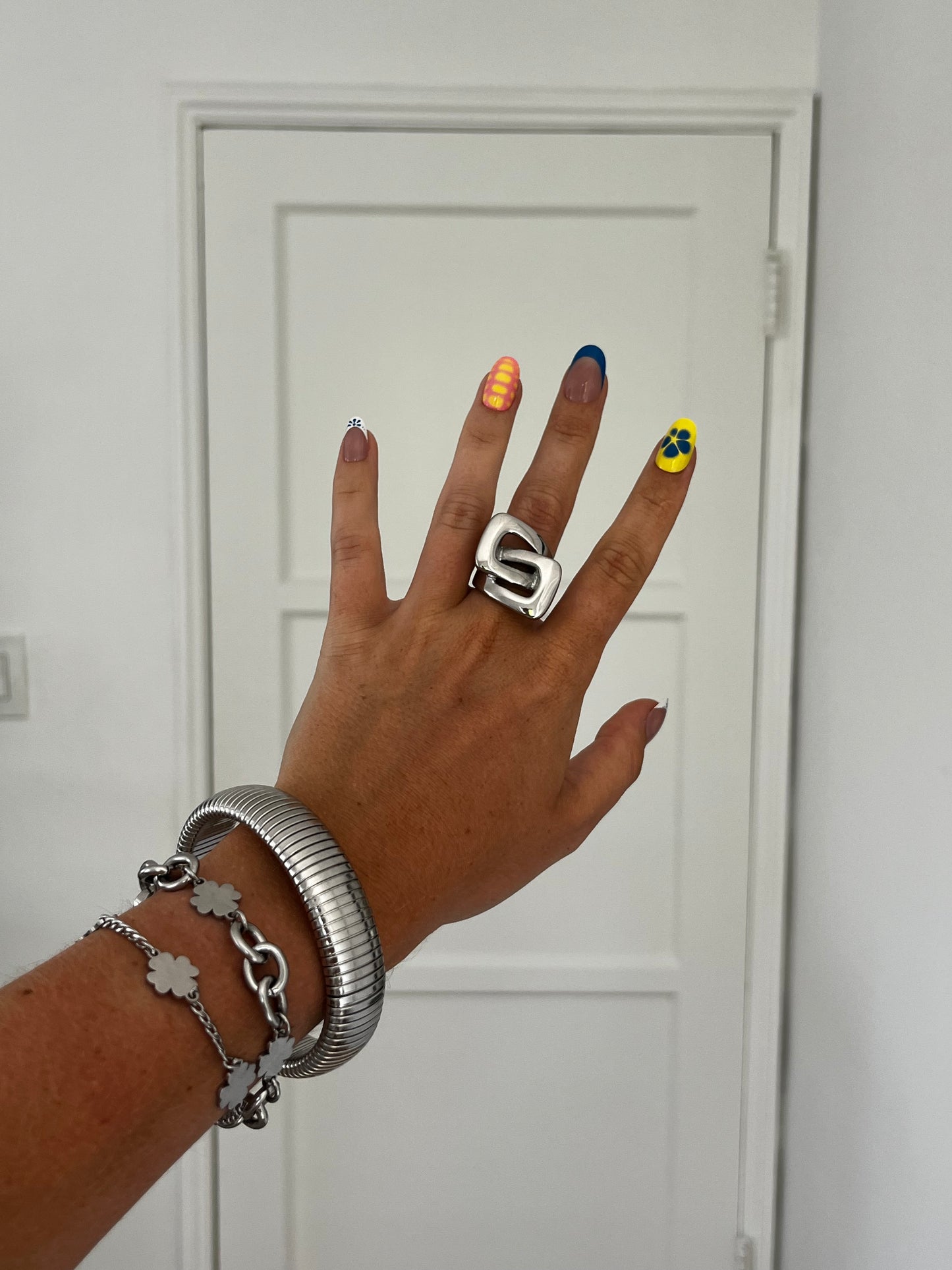Model wearing THE KARL bold cut-out stainless steel ring, unisex statement jewelry