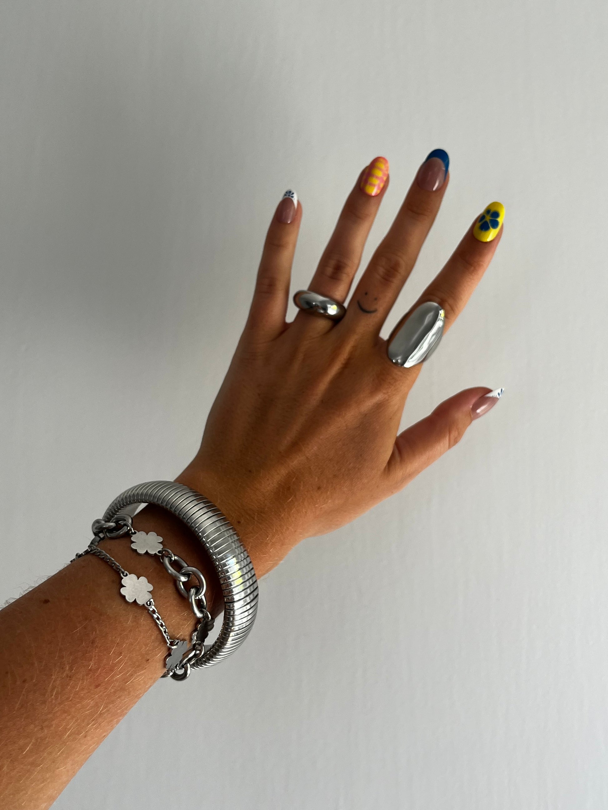 Straight on view of THE OVA stainless steel ring showing curved sculptural design, bold unisex jewelr