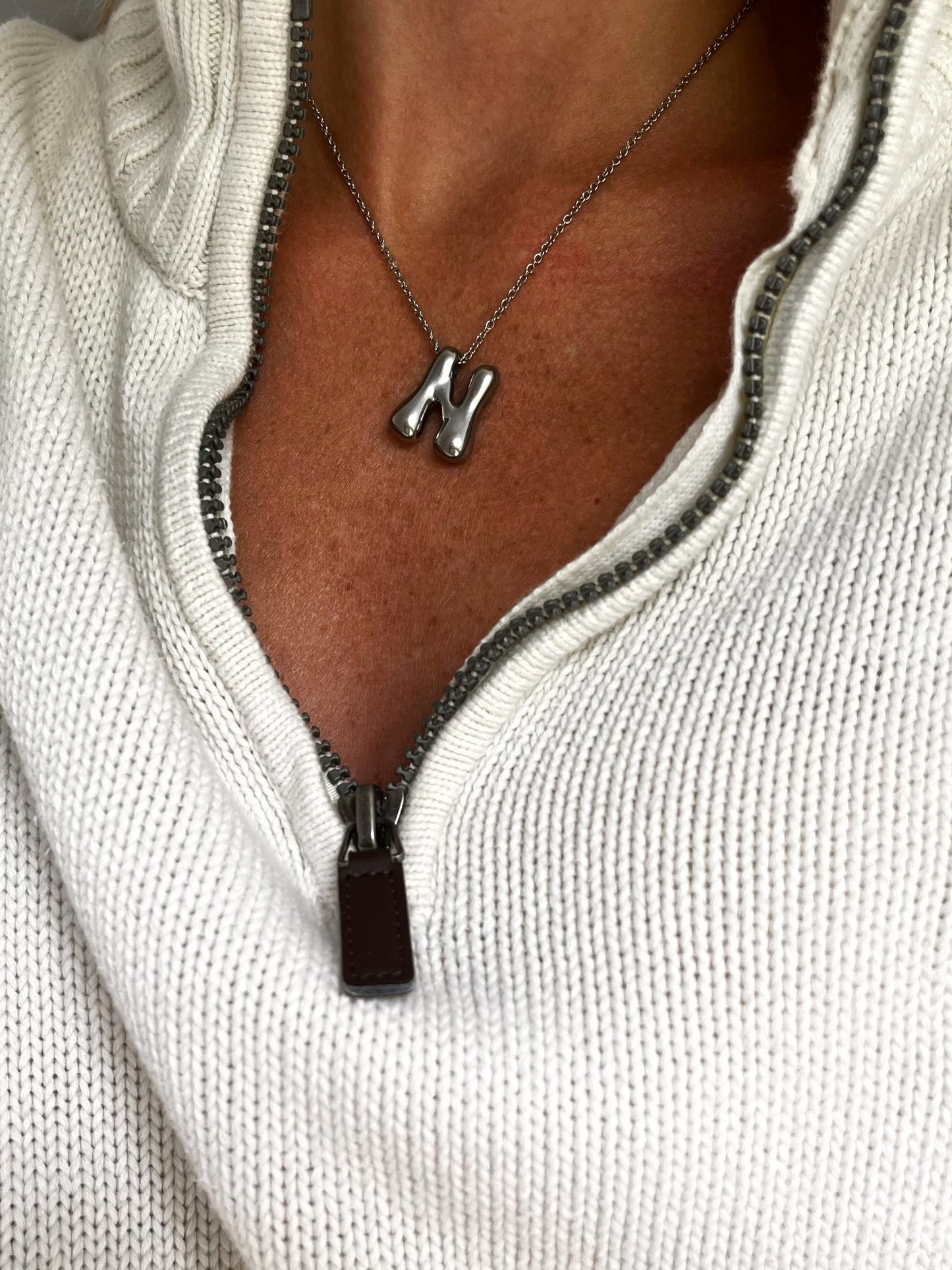 Unisex statement necklace with letter 'N' pendant on in stainless steel silver sweat and water proof resistant